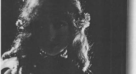 Shadowed woman in costume