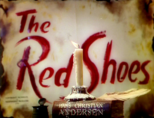 The Red Shoes logo, book with swash characters